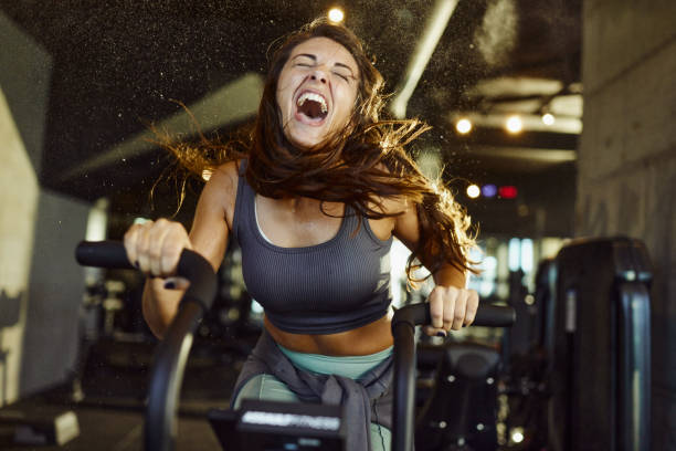 athletic woman on stationary bike