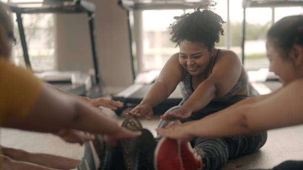 Group of friends exercising in the gym
