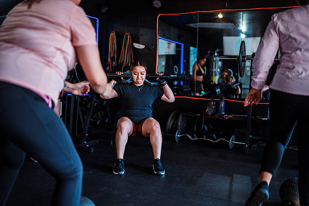 Latina woman doing strength workout in friends home gym