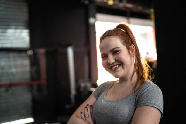 Portrait of young woman in a gym